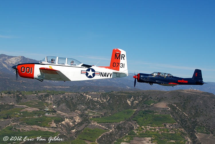 Marc Russell in his T-34 and Ron Lee in his Nanchang
            CJ-6A.