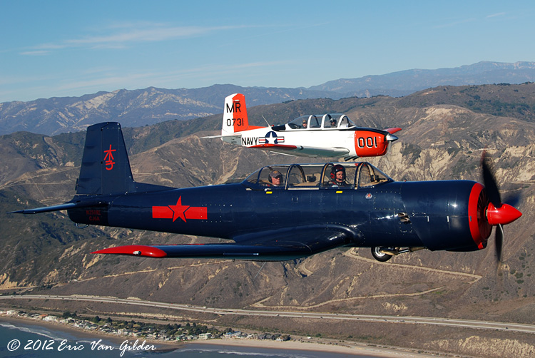 Ron Lee in his Nanchang CJ-6A and Marc Russell in
            his T-34 Mentor.