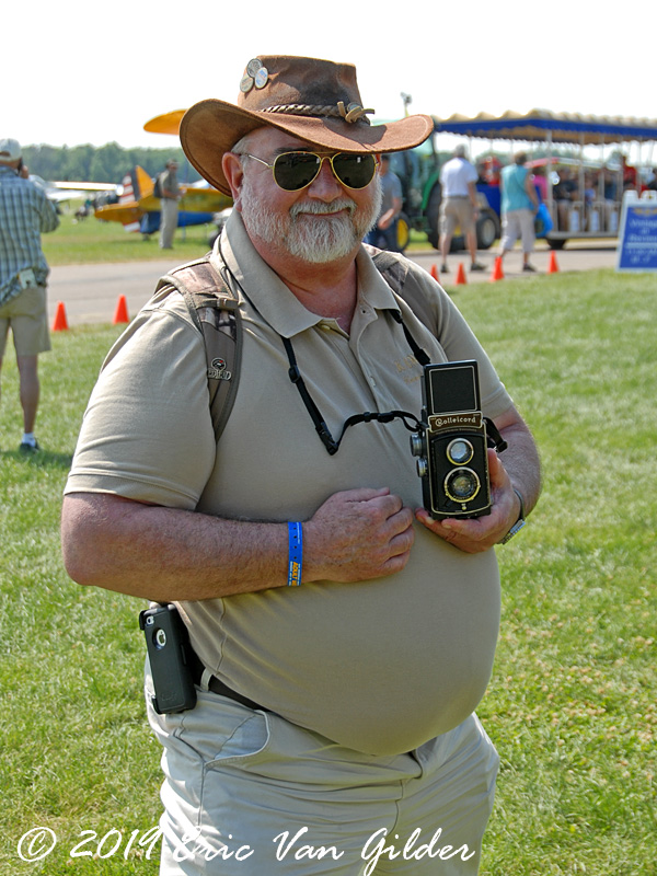 Man with a German
            Rolleicord Camera that his father took from an SS soldier in
            WWII