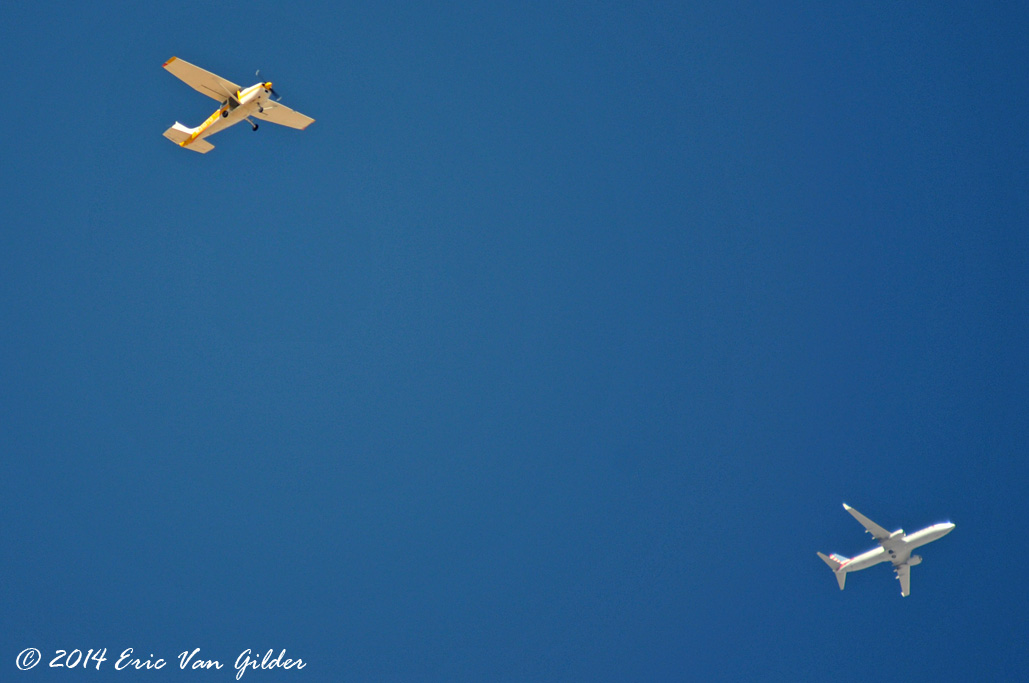 Skydiver jump plane and and airliner up high