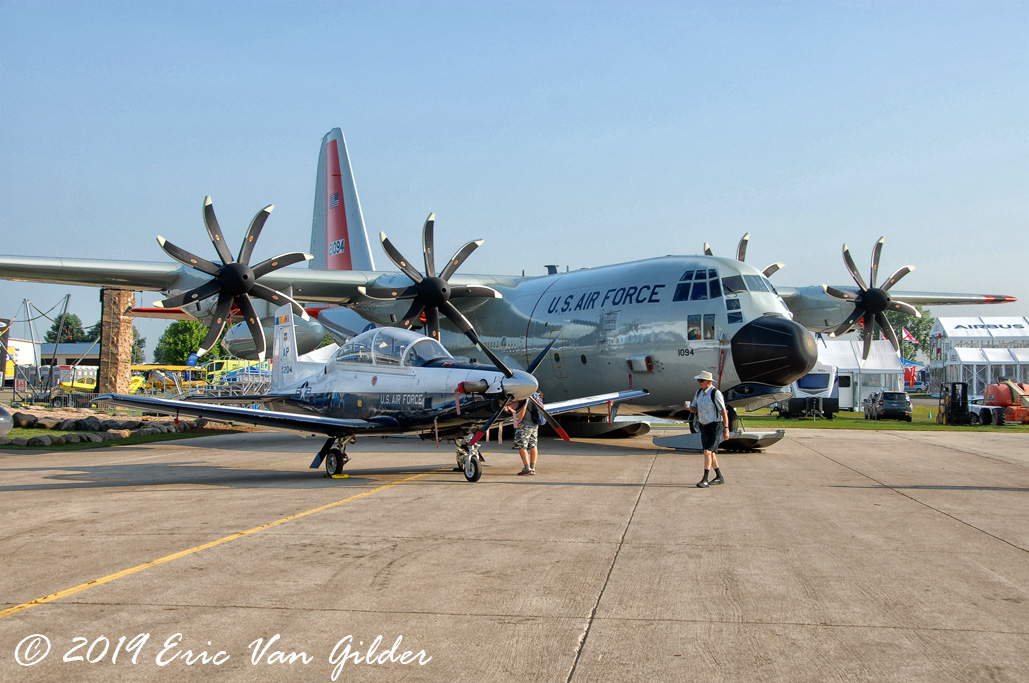 T-6 Texan II and a
            C-130 in the plaza