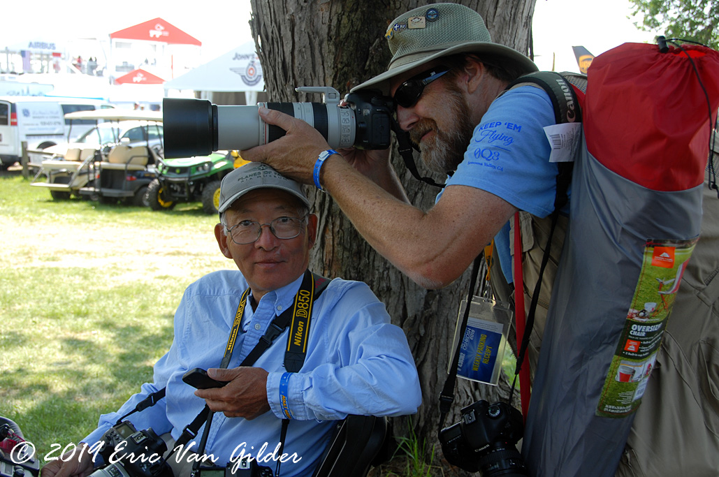 Par Yonemoto an Roger Cain
            clowning around near the press headquarters.